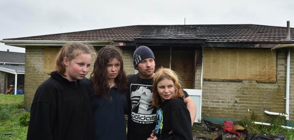 Chloe (13), Alyssa (16), Brendon (38) and Savannah (11) Carter in front of their Mulford St house...