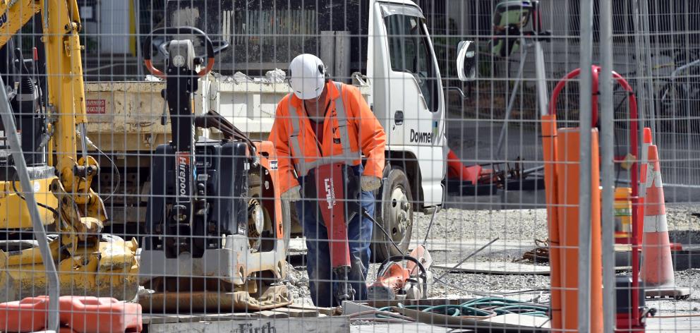A worker uses a jackhammer during landscaping construction work at the University of Otago campus...
