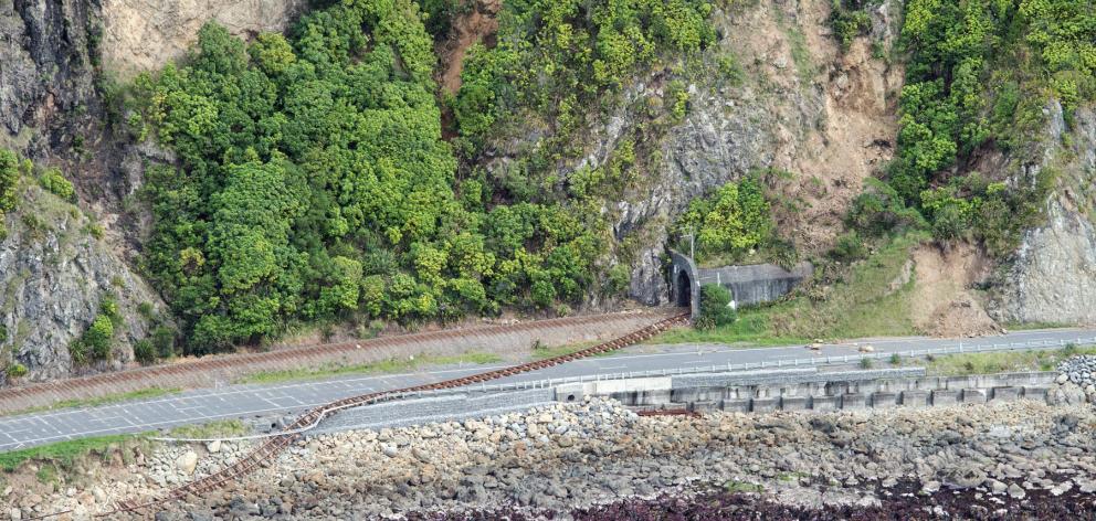A railway line lies damaged on the road near Kaikoura. Photo: Reuters