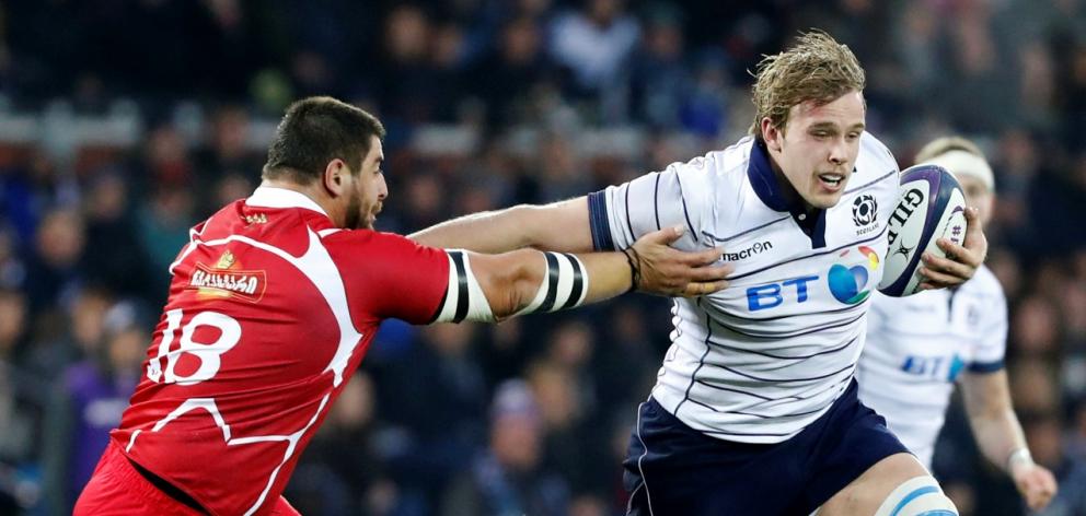 Scotland's Jonny Gray tries to get past Georgia's Dudu Kubriashvili. Photo Reuters