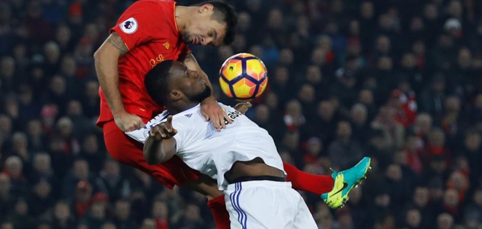 Liverpool's Dejan Lovren (L) vies for the ball with Sunderland's Victor Anichebe. Photo Reuters