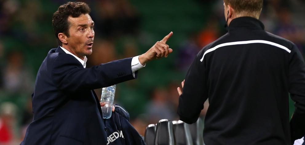 Adelaide coach  Guillermo Amor  remonstrates with the fourth official during the  match againt...