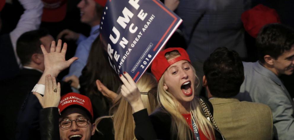 Trump supporters cheer on election night as results come in. Photo: Reuters