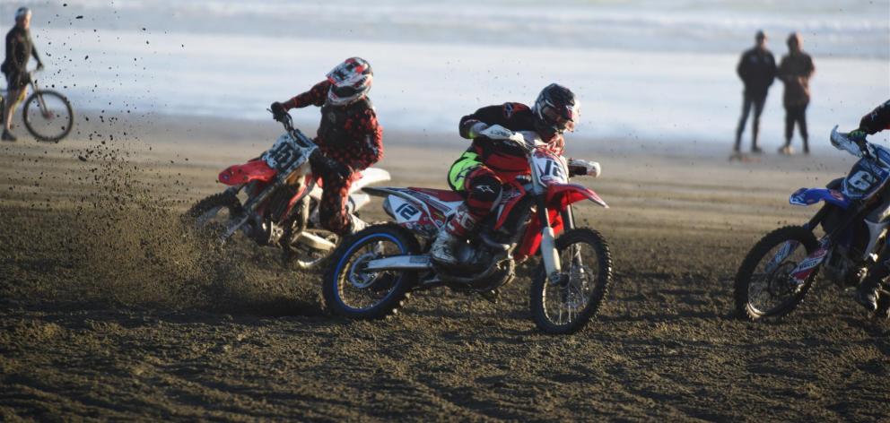 Competitors from previous years contest the New Zealand Beach Racing Championships at Oreti Beach which is part of the Burt Munro Challenge. Photo supplied.