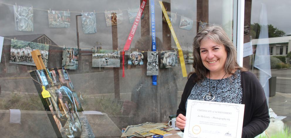 Photographer Joanne McLeary shows off the display which won her first prize. Photo by Samuel White.