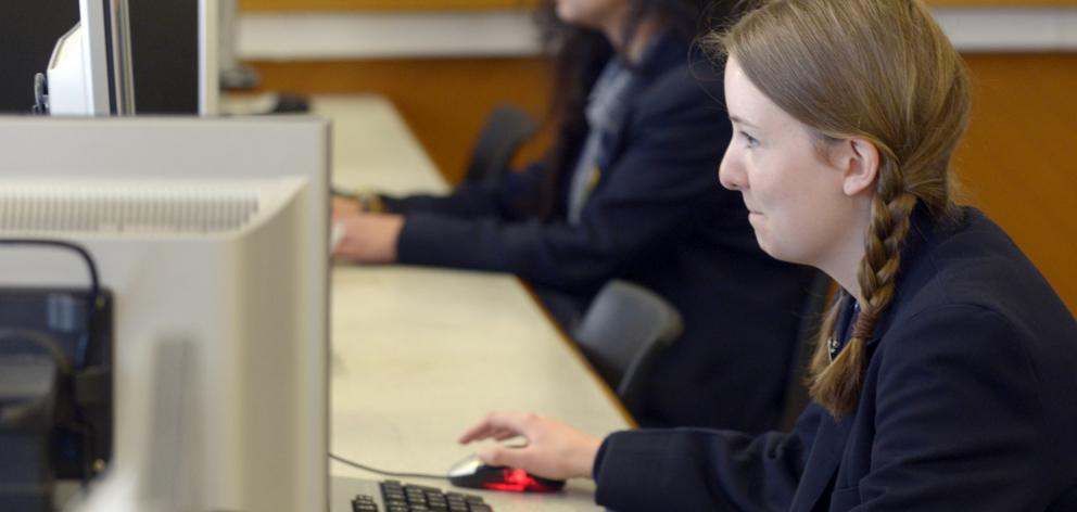 Otago Girls’ High School pupils Lucy Pollock (foreground) and Veronique Montalba settle down at...