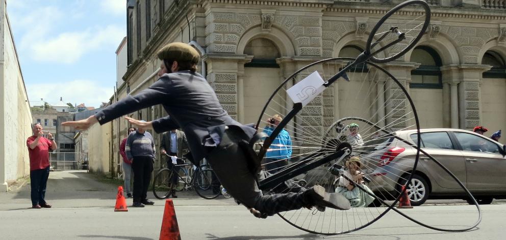 Oamaru penny-farthing enthusiast Oliver Briggs takes a spectacular tumble during a race at the...