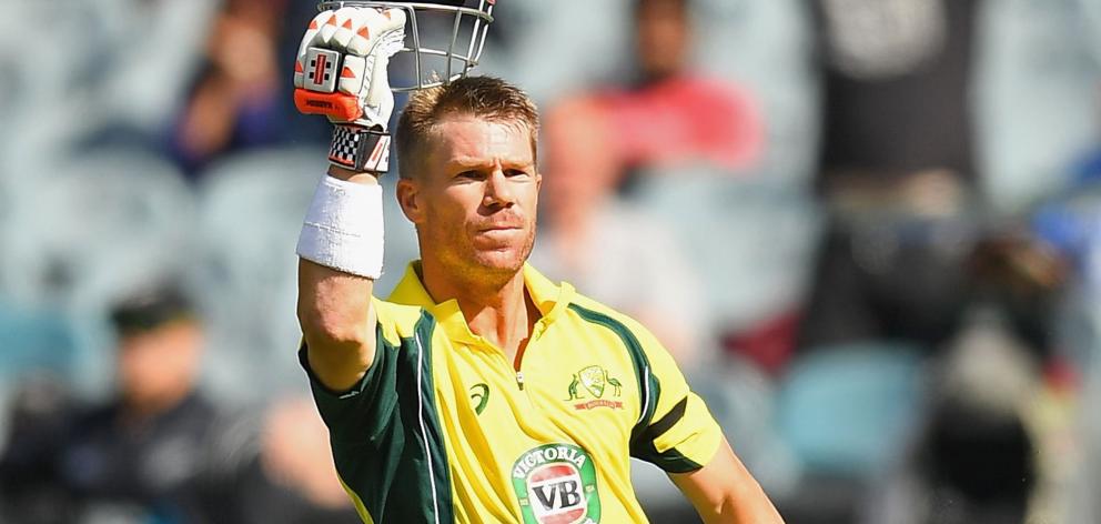 Australia opener David Warner celebrates bringing up his century in the third one-day...