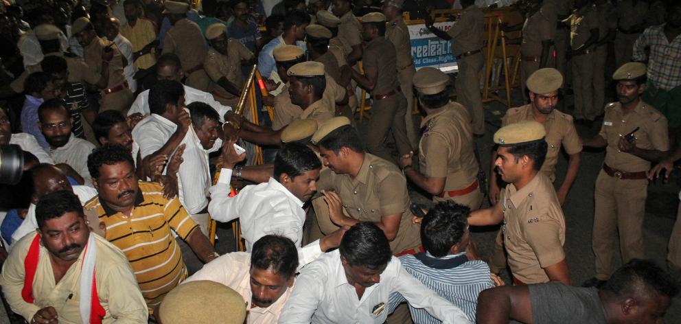 Police stop well-wishers as they gather outside the hospital in Chennai where  Tamil Nadu Chief...