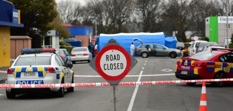 A crime scene is set up at Ashburton Work and Income Centre after two people were shot dead and a...