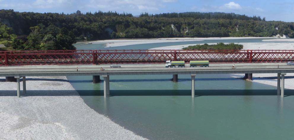 A photograph altered to show the position of the new Taramakau River road bridge, just downstream...