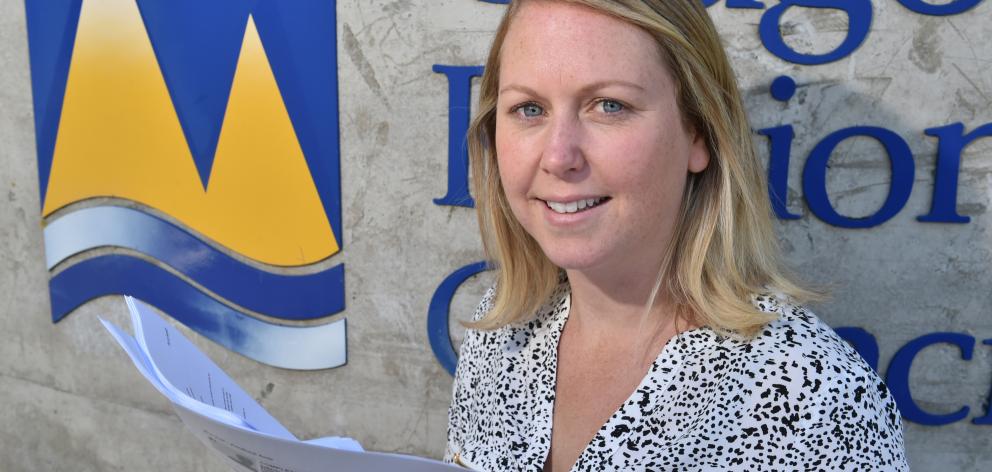 Otago Regional Council digital communications adviser Gemma Wilson holds more than 130...