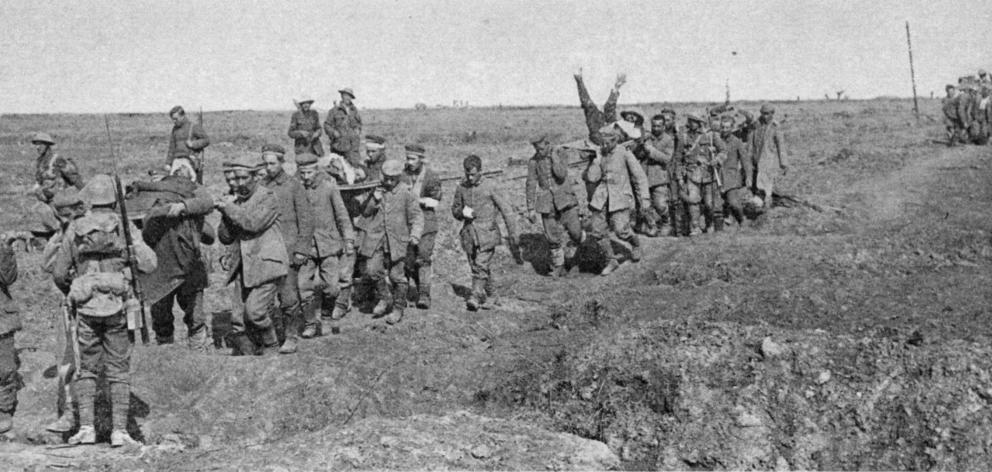 German prisoners coming back from Morval in France, carrying British wounded. — Otago Witness, 13...