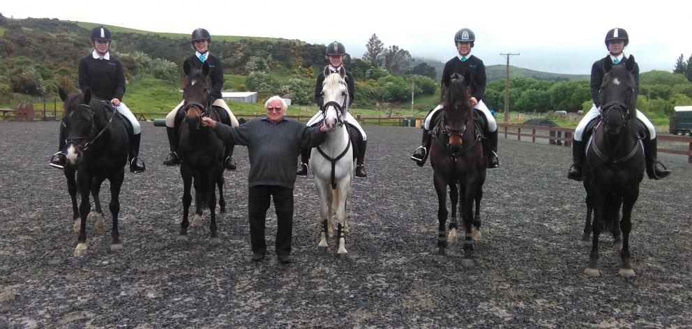 Saddleview Pony Club patron and former president Bob Fairhurst  (on foot) with riders (from left)...