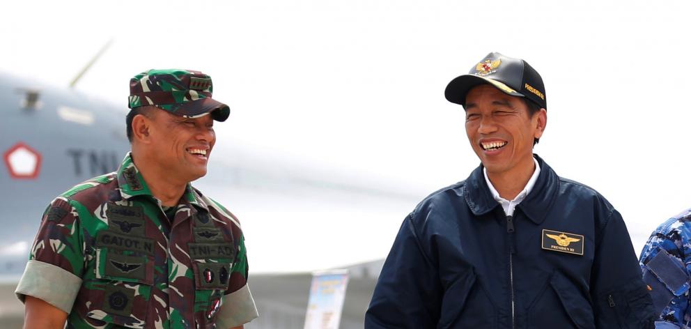 Indonesia's President Joko Widodo talks with military chief Gatot Nurmantyo in this Reuters file...