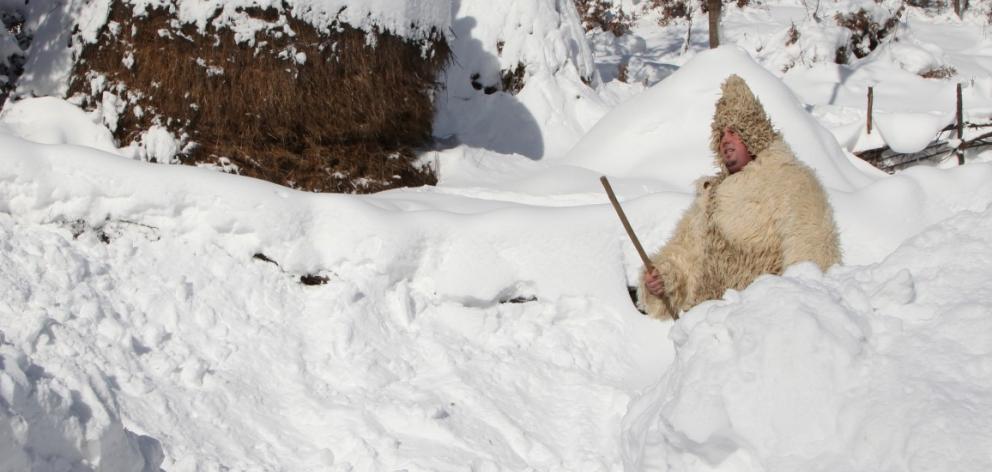 A man walks in deep snow in the village of Jezerc, Kosovo. Photo Reuters