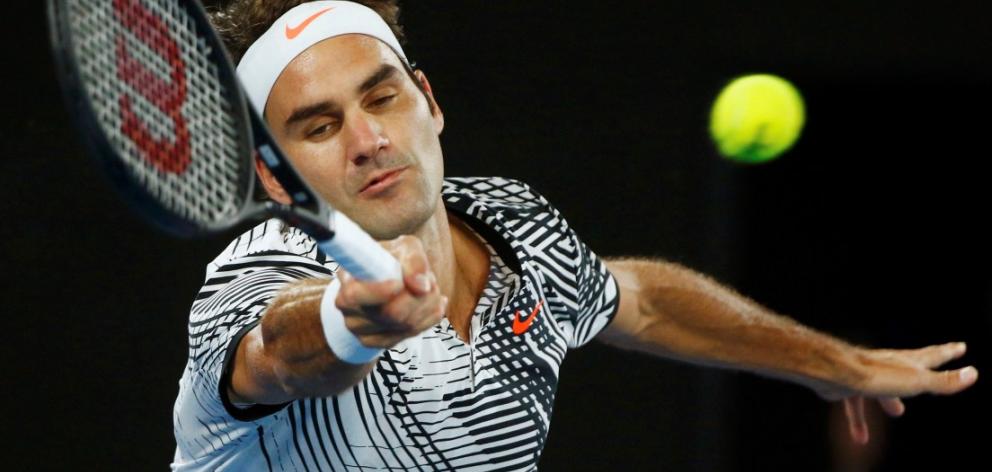 Roger Federer plays a shot on his way to victory over Tomas Berdych. Photo: Reuters