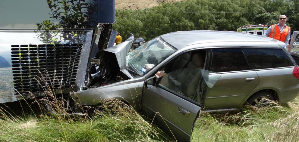 A family escaped serious injury after this car and bus collided on the Lindis Pass yesterday....