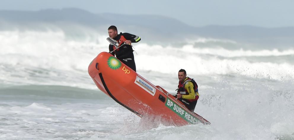 A Brighton Surf Lifesaving Club IRB battles rough seas during the search on Friday. Photo Gregor...