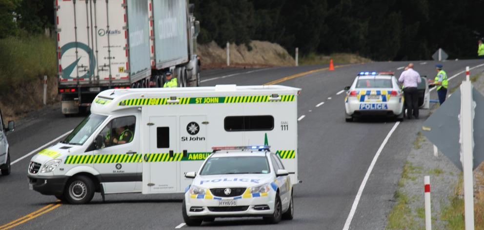 Emergency services at the scene of the crash on State Highway 1 south of Milton this morning....