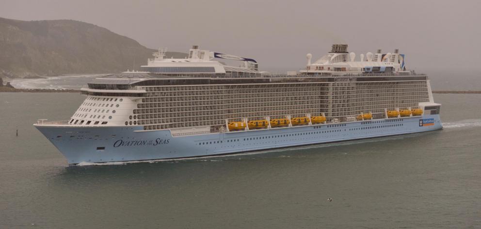 Ovation of the Seas passes through the heads of the harbour on its way to Port Chalmers earlier...