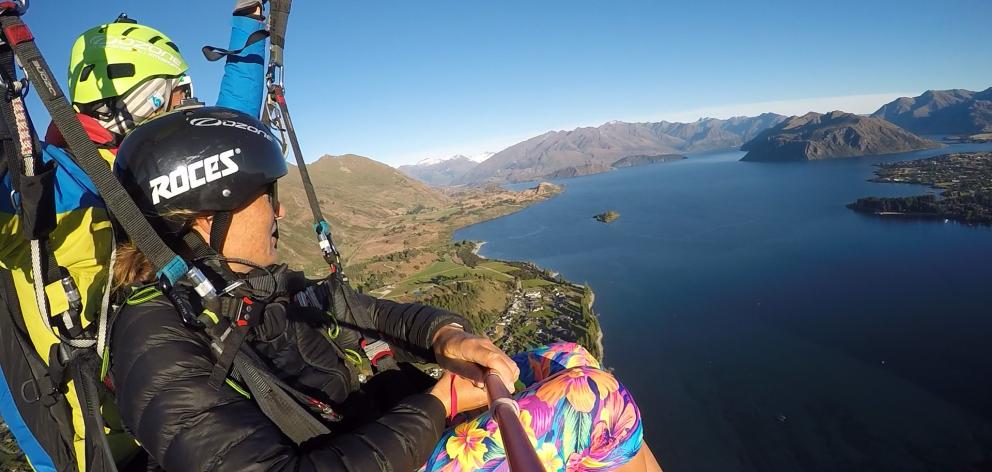 Annabel Anderson (front) paraglides back from training with pilot Stefano Gigli. Photo: Annabel...