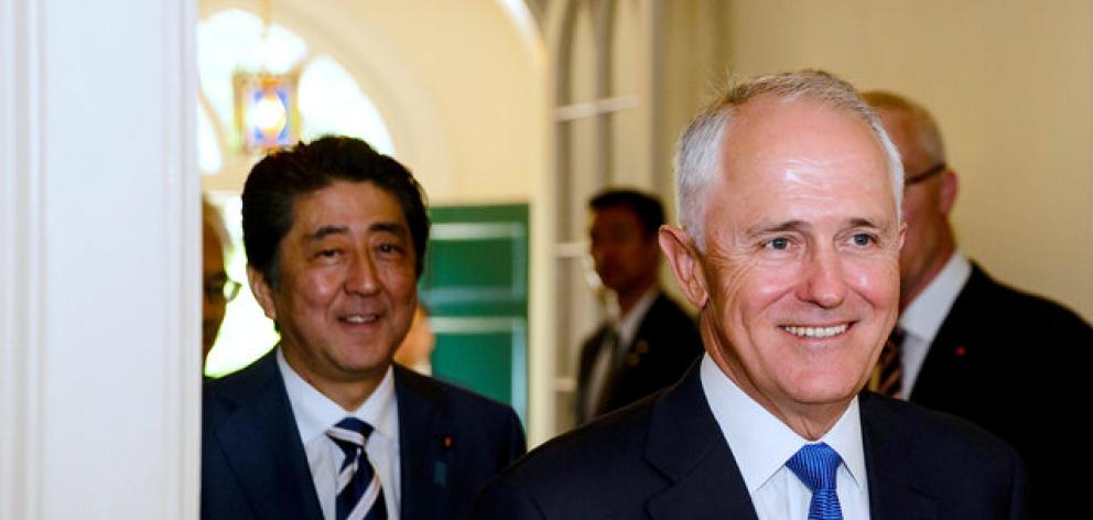 Japanese PM Shinzo Abe and Australian PM Malcolm Turnbull spoke of their desire to see the TPP ratified, despite opposition from Trump. Photo: Reuters