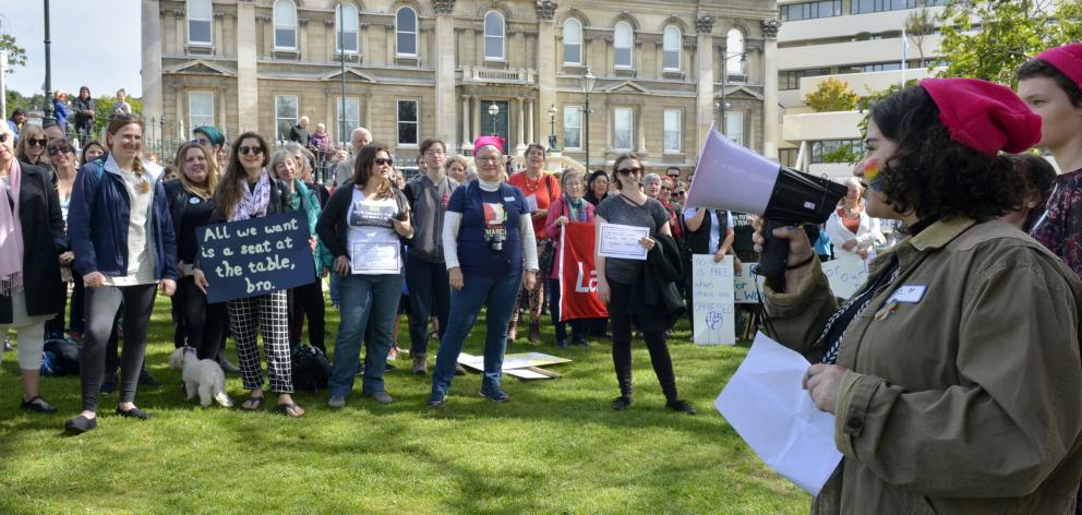 Alex Hall (15) leads a chant during the Women's March Global gathering in Dunedin's Octagon on...