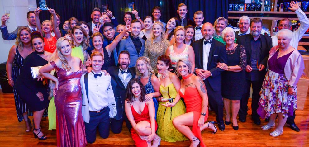 The cast and crew of Grease: The Arena Spectacular Live celebrate at the Otago Southland Theatre...