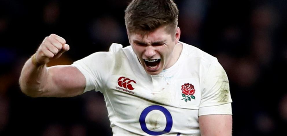 England's Owen Farrell celebrates after the game. Photo Reuters 