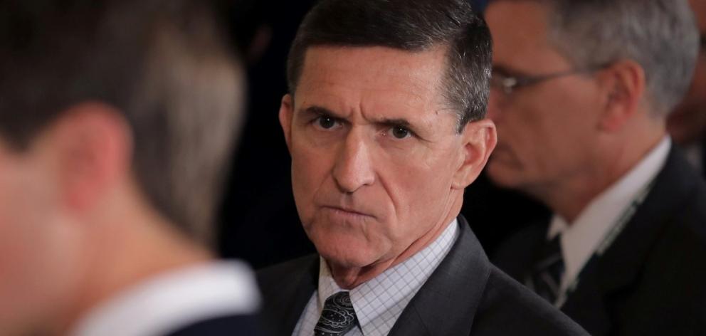 Michael Flynn (C) arrives at a joint news conference between Canadian Prime Minister Justin...