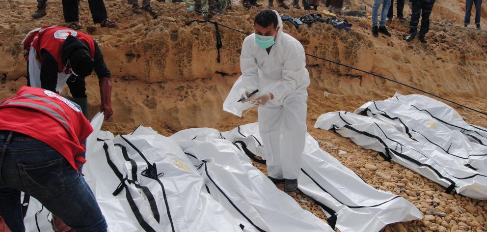 Bodies of migrants were also washed up on a beach near the city of Zawiya, Libya. Photo: Reuters
