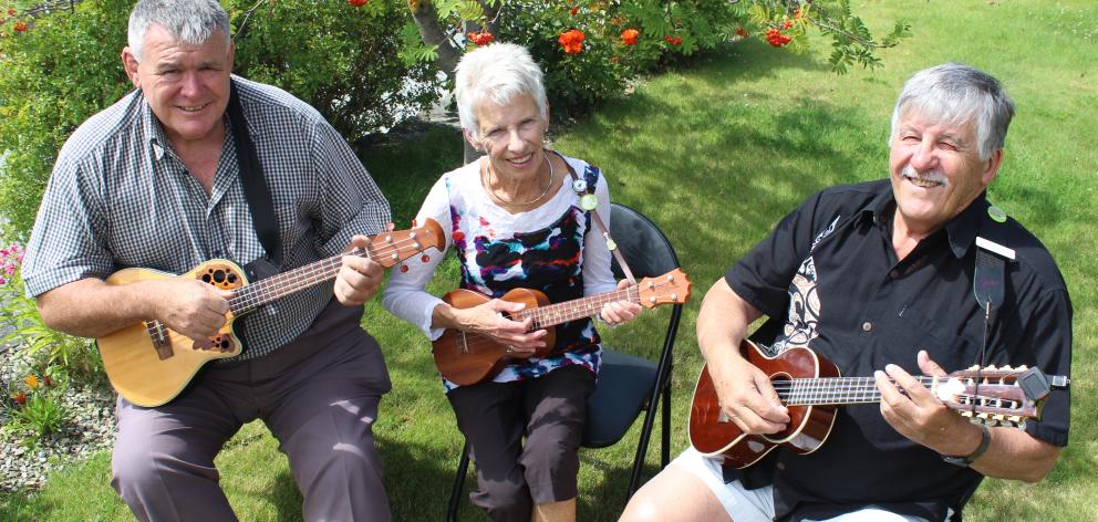 Lauder Ukulele Festival organisers Bruce Macdonald (left), of Lauder, and Diane and Barry Bemrose, of Alexandra, practise ahead of a big weekend. Photo by Jono Edwards.