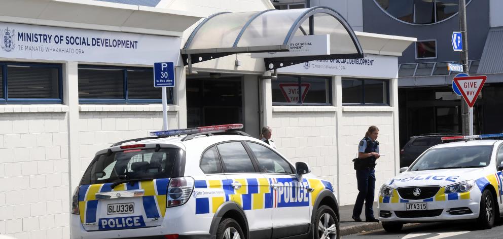 Police speak to witnesses of an assault at the Ministry of Social Development's South Dunedin...