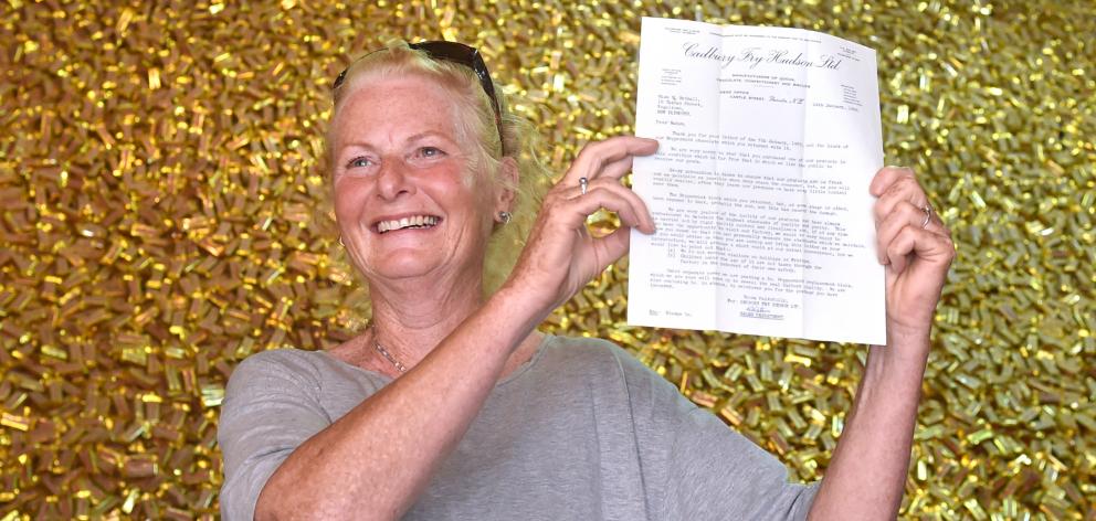 Marilyn Bethell (62) at the Cadbury factory in Dunedin, with her 1969 letter inviting her to tour...