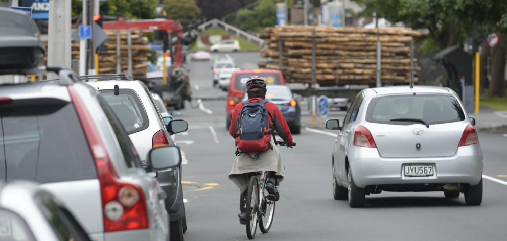 A cyclist negotiates Albany St, a priority area for a planned campus safety and accessibility...