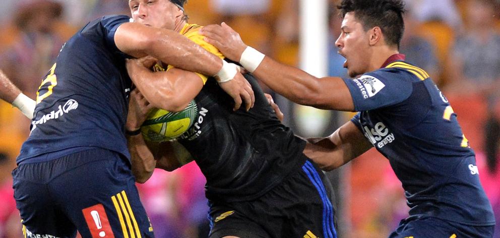 Hugh Renton of the Hurricanes takes on the defence during the Rugby Global Tens match with Highlanders at Suncorp Stadium in Brisbane. Photo: Bradley Kanaris/Getty Images