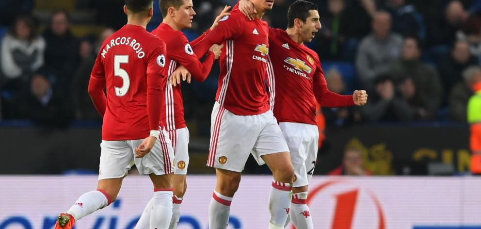 Zlatan Ibrahimovic of Manchester United (2R) celebrates with team mates as he scores their second goal during the Premier League match between Leicester City and Manchester United at The King Power Stadium on February 5, 2017. Photo: Reuters