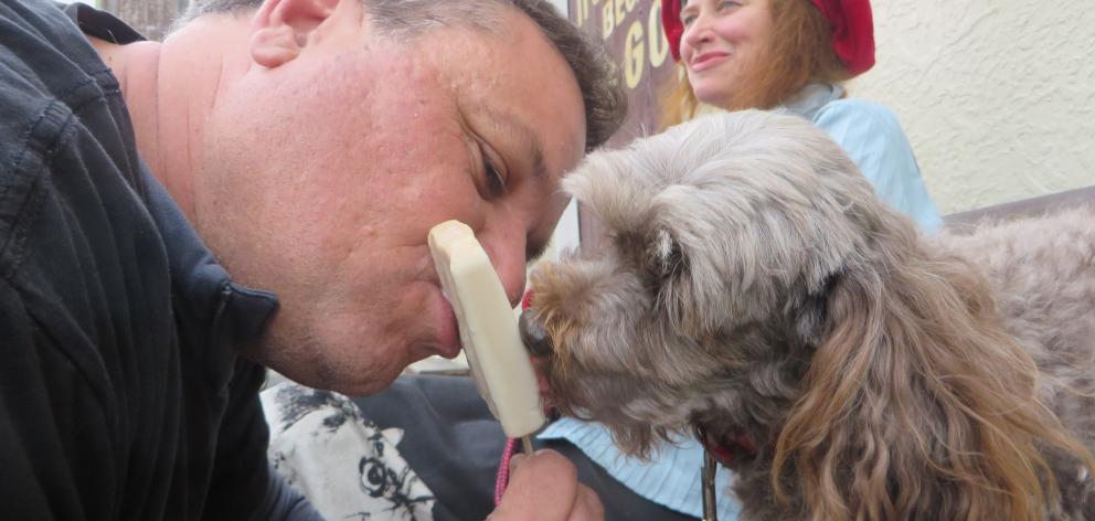 Ice cream and ice block creator Shaun Osborne with Tuppence the dog, a fan of his new Ice Dog...