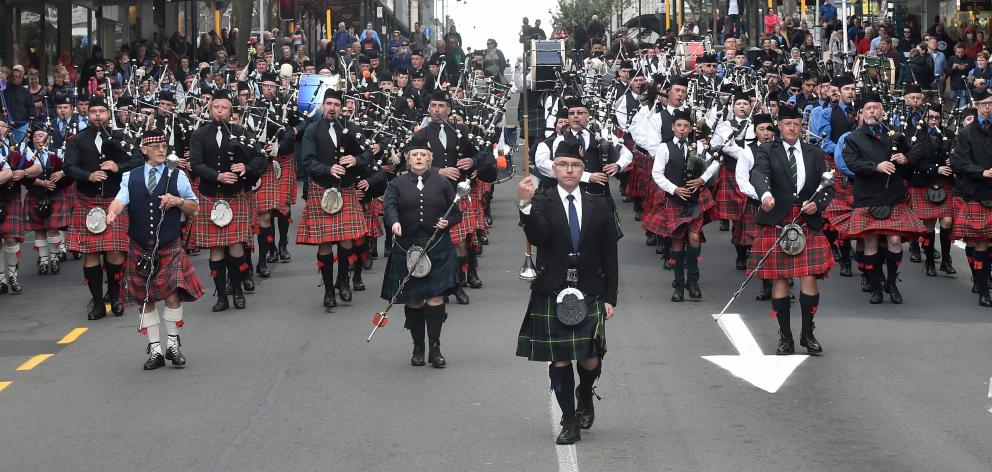 Andrew McLellan leads the pipe bands into the Octagon on Saturday from Princes St. Hundreds of ...