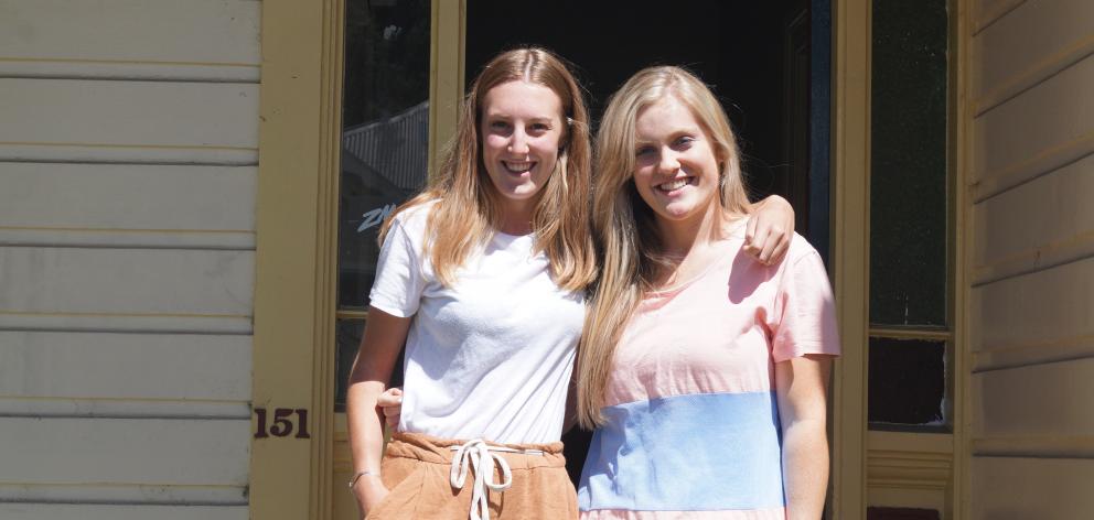 Second-year students Greer Ferguson (left), of Queenstown,  and Julia Landels, of Balclutha, are waiting for their other three flatmates to join them in their new abode in Dunedin North. PHOTO: GRETA YEOMAN