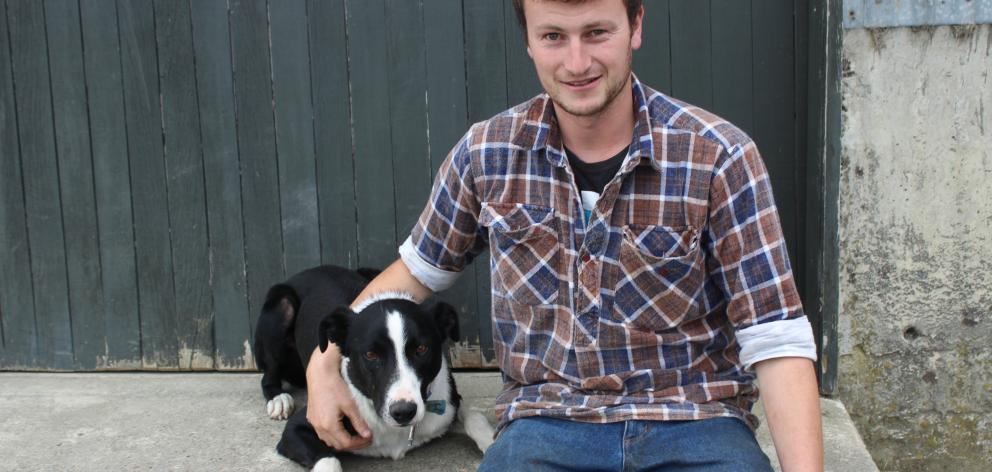 Te Rae Genetics owner Chris Wilson, flanked by dog Scott, reflects on his journey taking on his grandparents stud and where he is heading at his home recently. Photo: Nicole Sharp