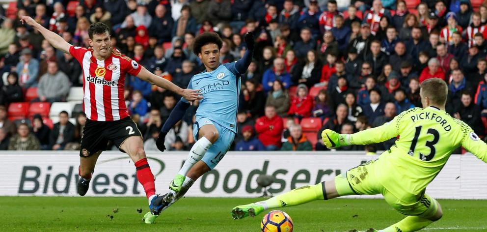 Manchester City's Leroy Sane shoots to score their second goal. Photo: Reuters