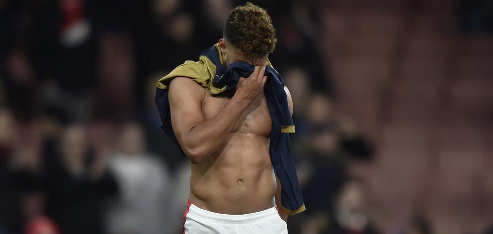 Arsenal's Alex Oxlade-Chamberlain walks off after the game. Photo Reuters