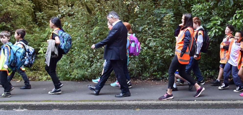 Dunedin Mayor Dave Cull walks to school with Arthur Street School pupils along Maori Rd yesterday morning, as part of Walk n Wheel to School Week. Photo by Gregor Richardson.