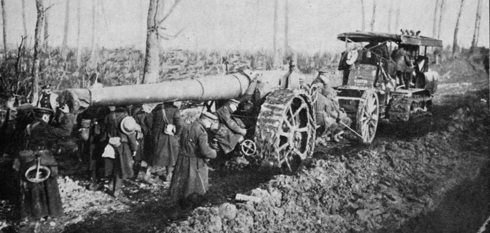 A British big gun is hauled by caterpillar tractor along a muddy road to the front in Northern France. - Otago Witness, 7.3.1917.