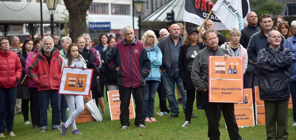 Rally attendees hold placards and listen to speeches in the Octagon this morning. PHOTO: PETER MCINTOSH 