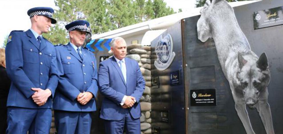 Constable Josh Robertson (left), Senior Const Bruce Lamb and Associate Justice Minister Mark...