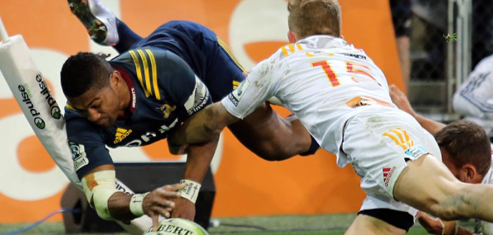 Highlanders winger Waisake Naholo shows impressive athleticism to score against the Chiefs. Photo...