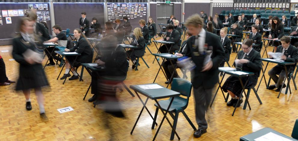 Pupils at Dunedin’s Kaikorai Valley College stream into the school hall for an NCEA exam. Photo by Stephen Jaquiery.